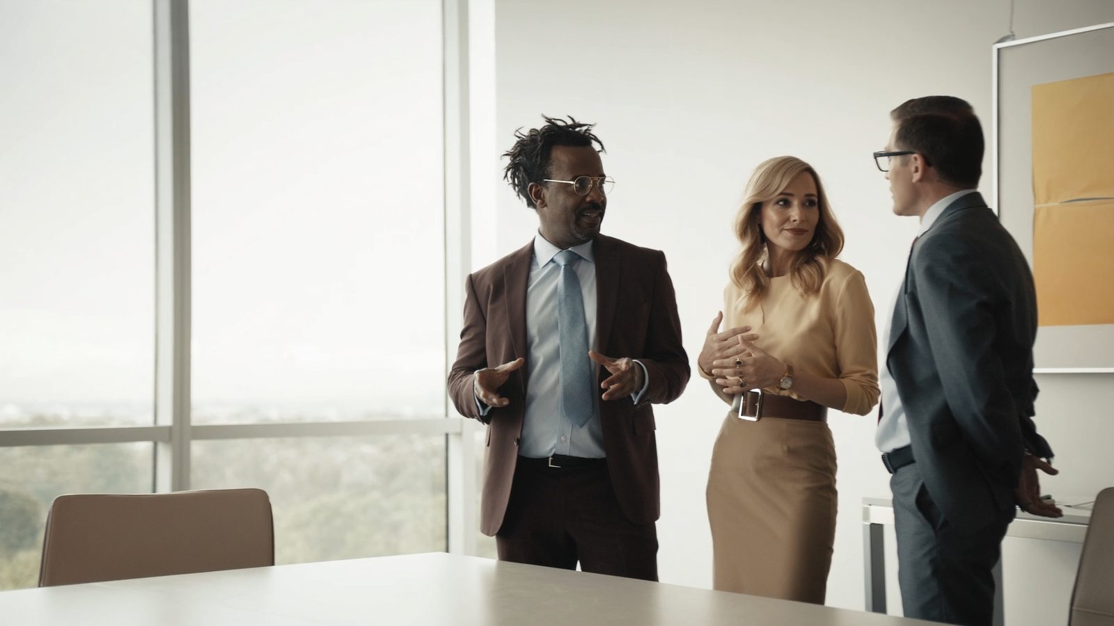 Marketing leaders in conversation in a modern office